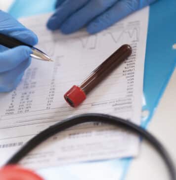 Woman analyzing the results of blood test.